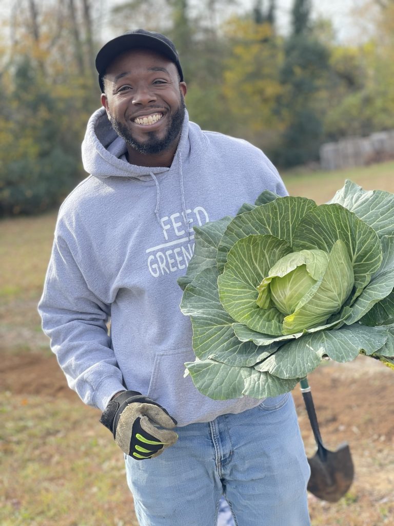 James Gardner of PDY&F Community Garden in Greensboro, NC with a cabbage